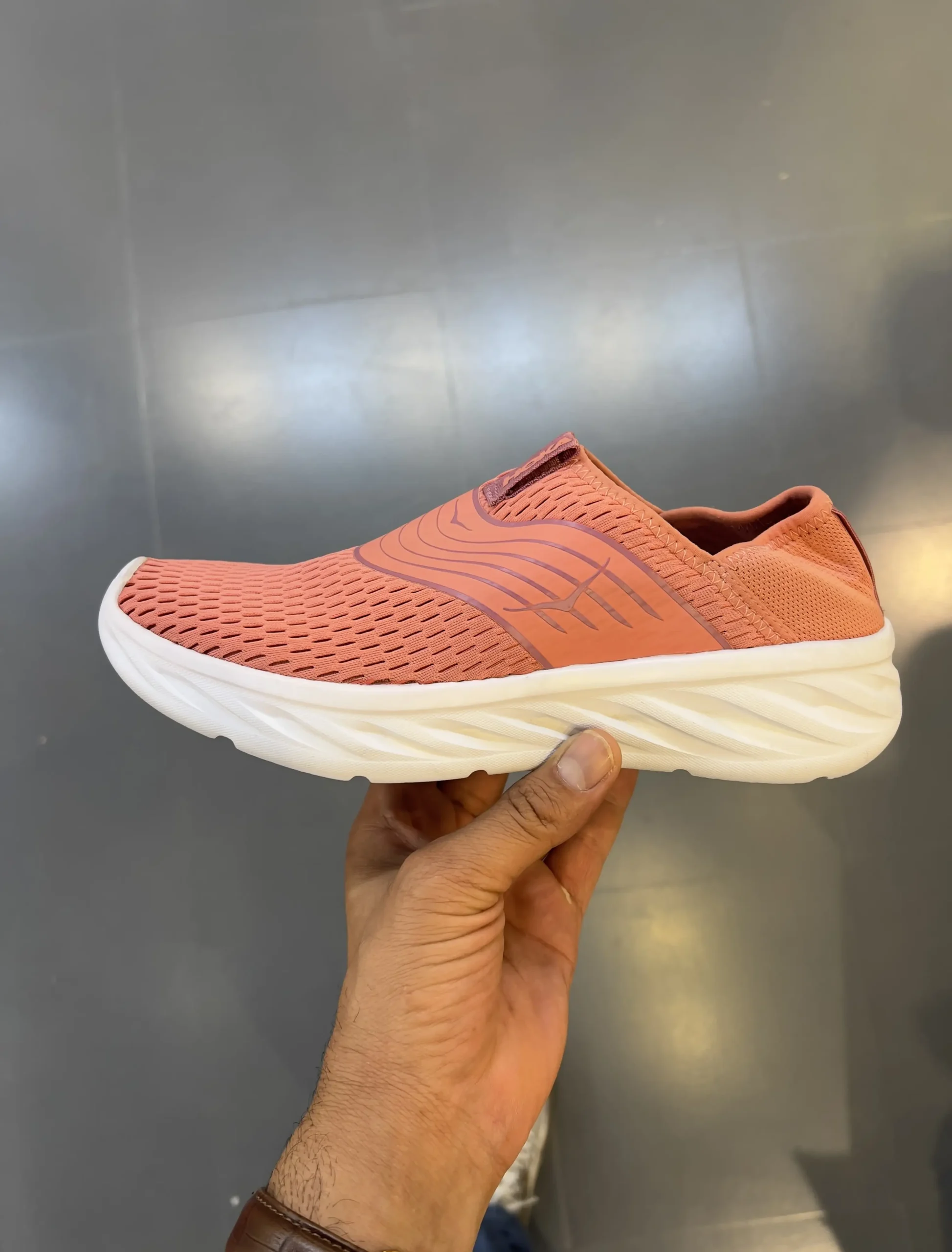 hoka-ora-recovery-shoe-1099678-lnt-hand-view hoka ora recovery shoe 1099678 lnt hand view scaled