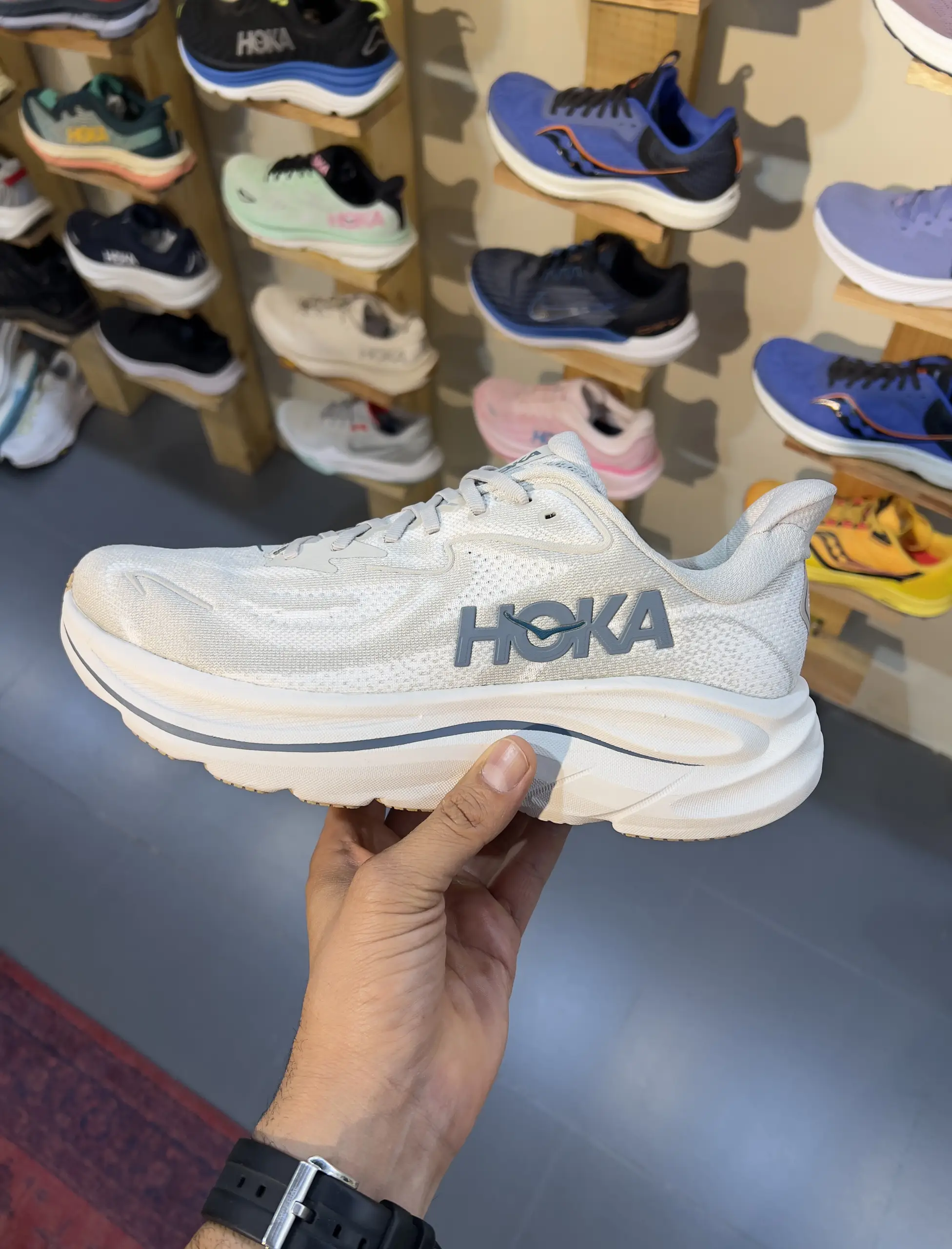 hoka-clifton-10-putty-grout-1162032-ptyg-hand-view hoka clifton 10 putty grout 1162032 ptyg hand view